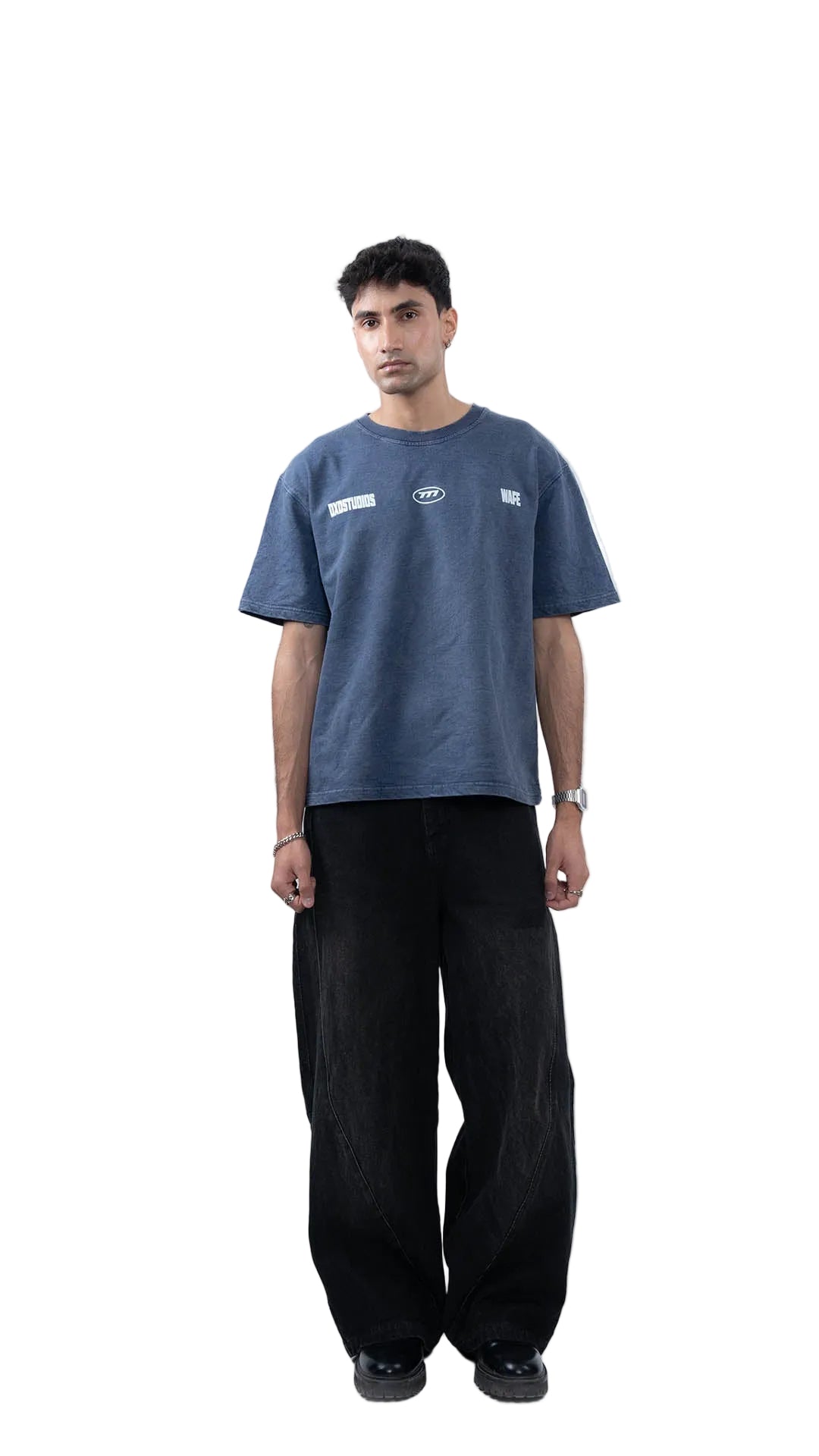 Man wearing a blue t-shirt and black pants on a white background