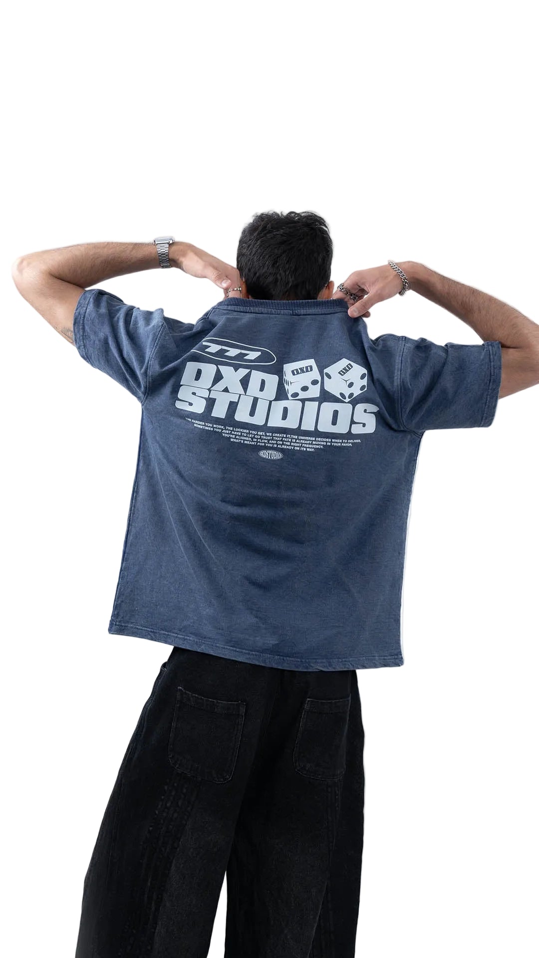 Man wearing a blue t-shirt and black pants on a white background