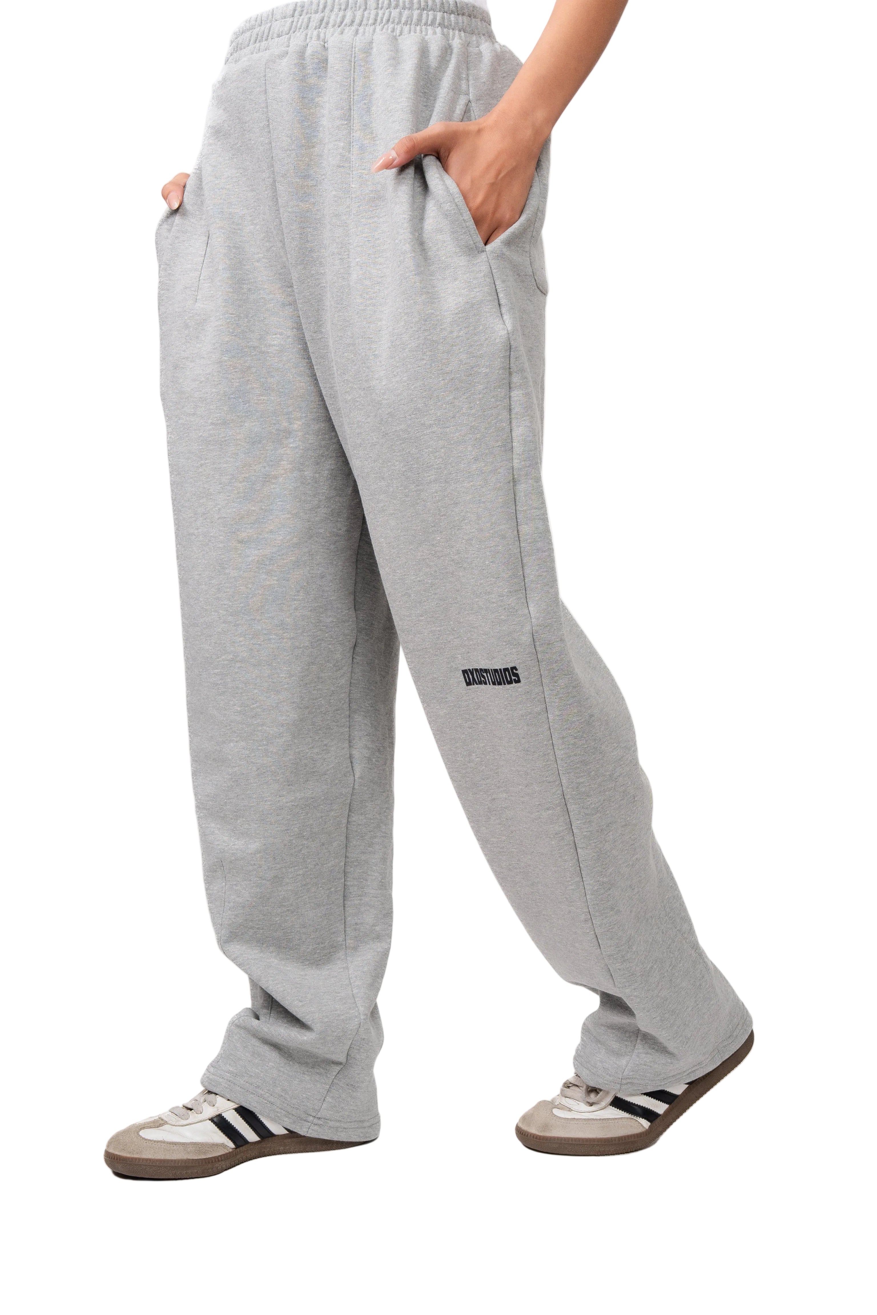 Gray sweatpants worn by a person on a white background